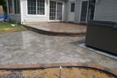 Raised Paver Patio and Hot Tub installed in New Hampshire By Natures Elite Landscaping Gilford New Hampshire, Belknap County
