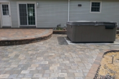 Raised Paver Patio with Hot Tub, installed by Natures Elite Landscaping New Hampshire
