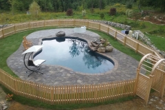 Pavers installed around a pool deck in New Hampshire